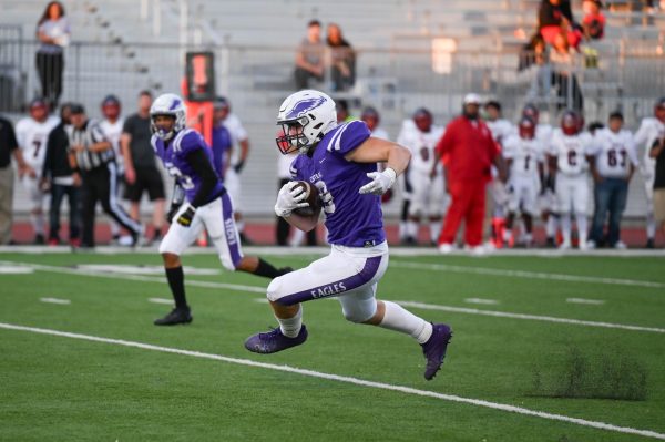 Ike Ackerman making his way towards the end zone in a game against Omaha South