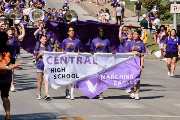 Central high band marching down Underwood Avenue