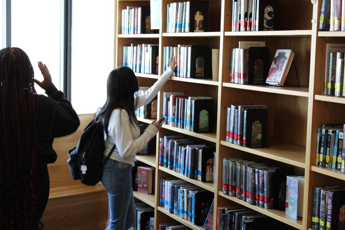 Students look to check out books in Central Library