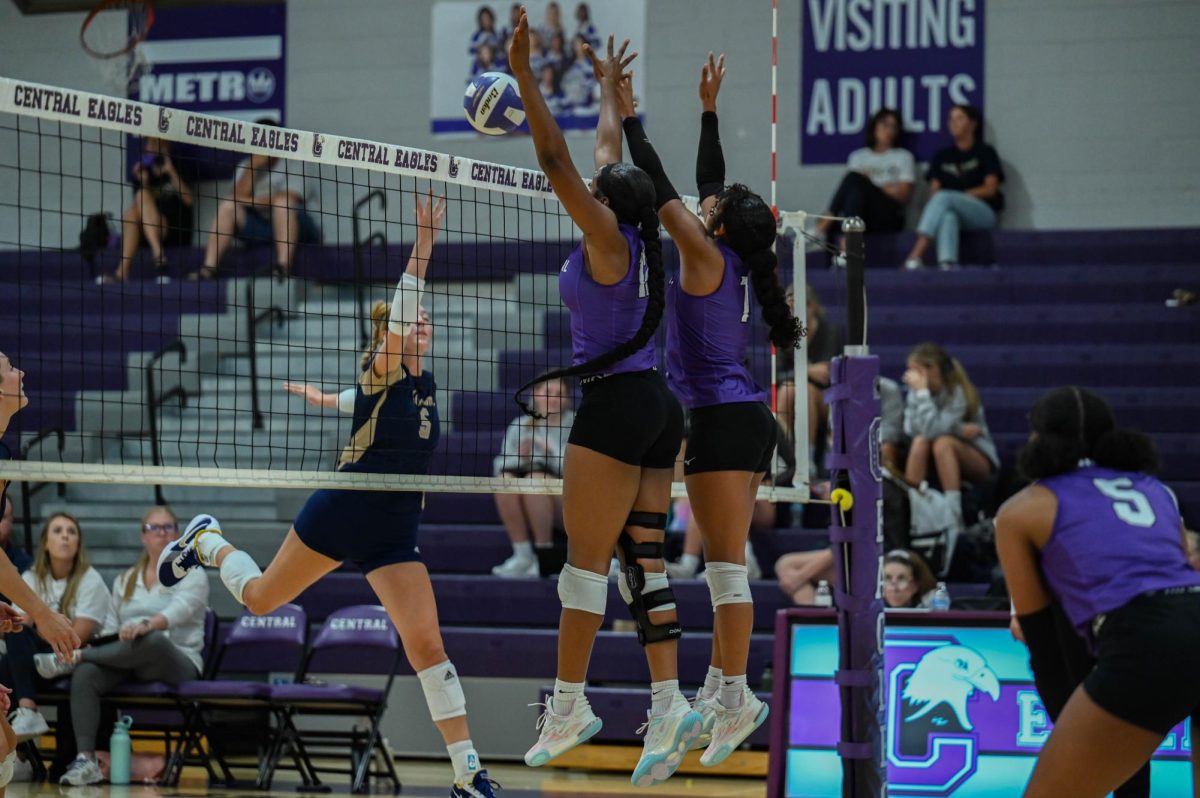 Senior Kashya Hall (Right) and Senior Tayah Perkins (Left) jump for a block against Elkhorn South