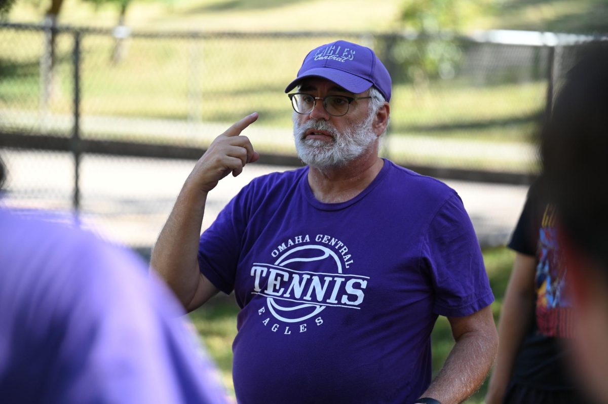 Coach Tucker talking to his team at practice 