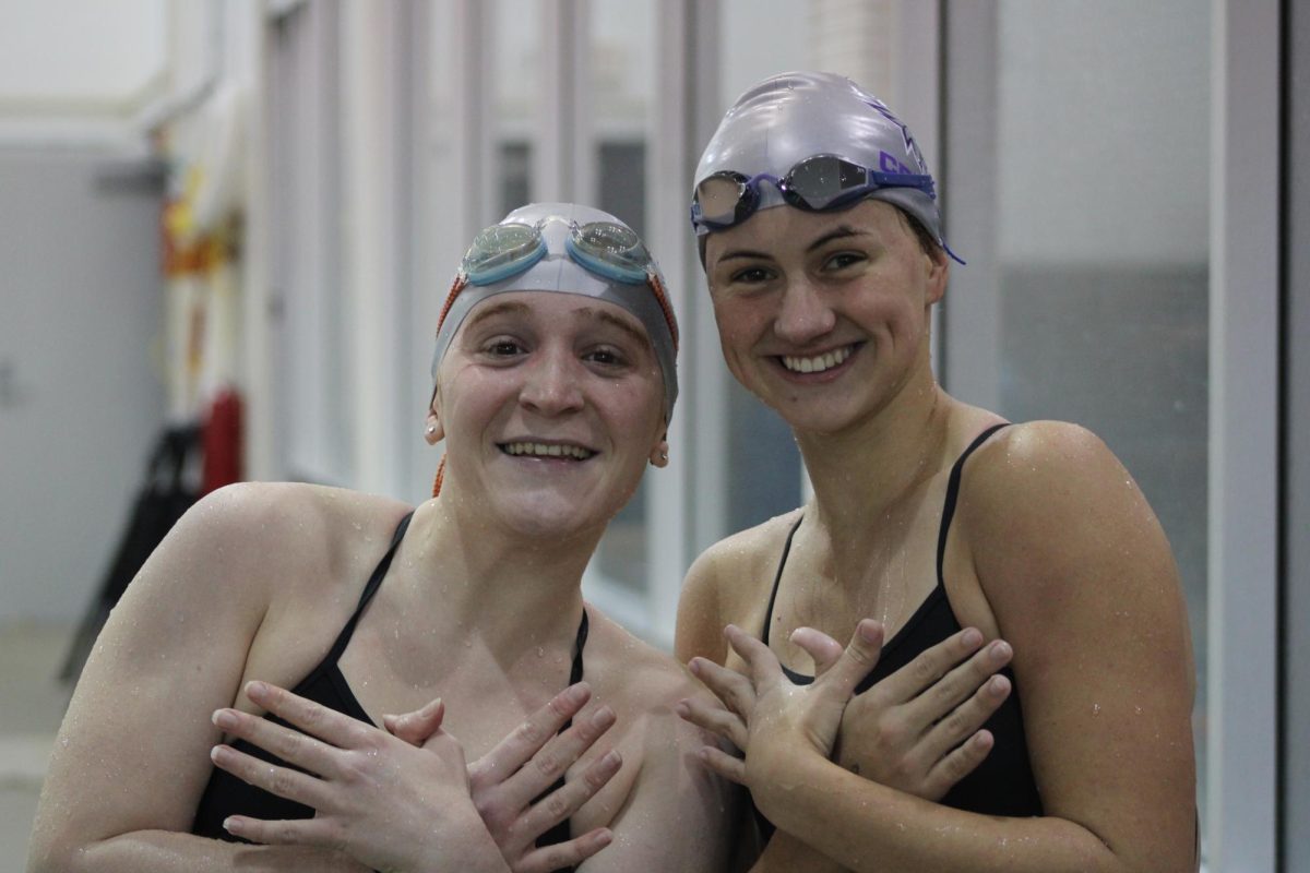 Seniors Renny Maxwell and Holland Robison pose for photo pre-relay race.